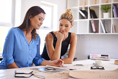 Buy stock photo Fashion designer, woman and teamwork for planning, brainstorming and thinking of creative project at office desk. Tailor or people with a magazine, catalog and collaboration for clothes production