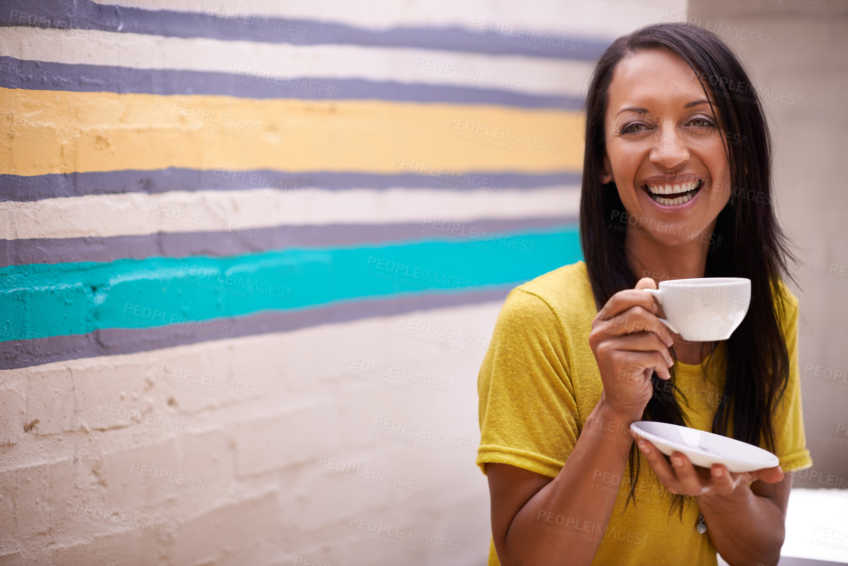 Buy stock photo Woman, drinking tea and smile outdoors, relax and laughing for humor or comedy by wall background. Female person, happy and hot beverage for positive attitude, comic and cup for latte or confidence