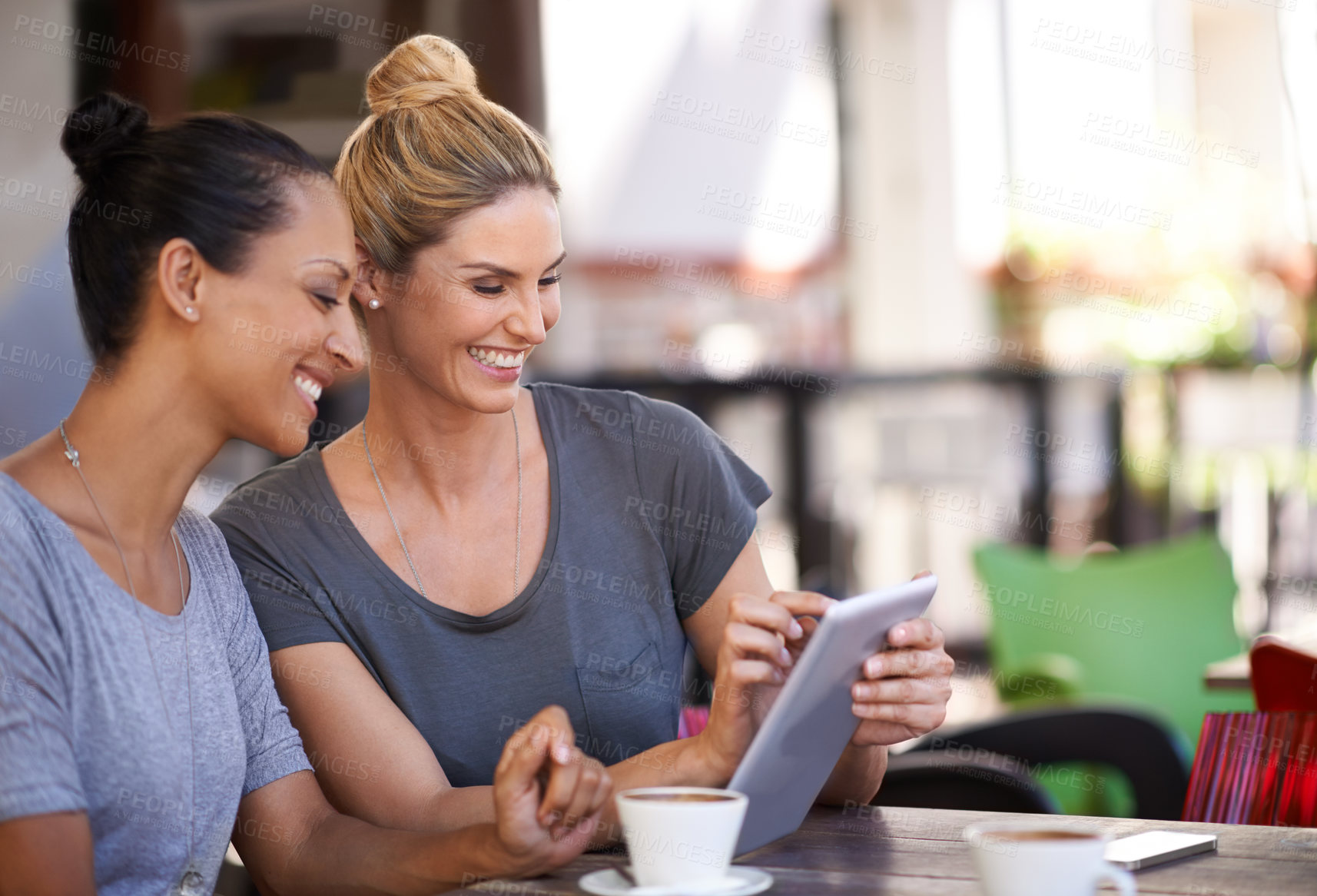 Buy stock photo Coffee shop, women and laugh together with tablet for social media meme or online joke, video and bonding for friendship. Female friends, digital technology and browse internet, website and outdoors.