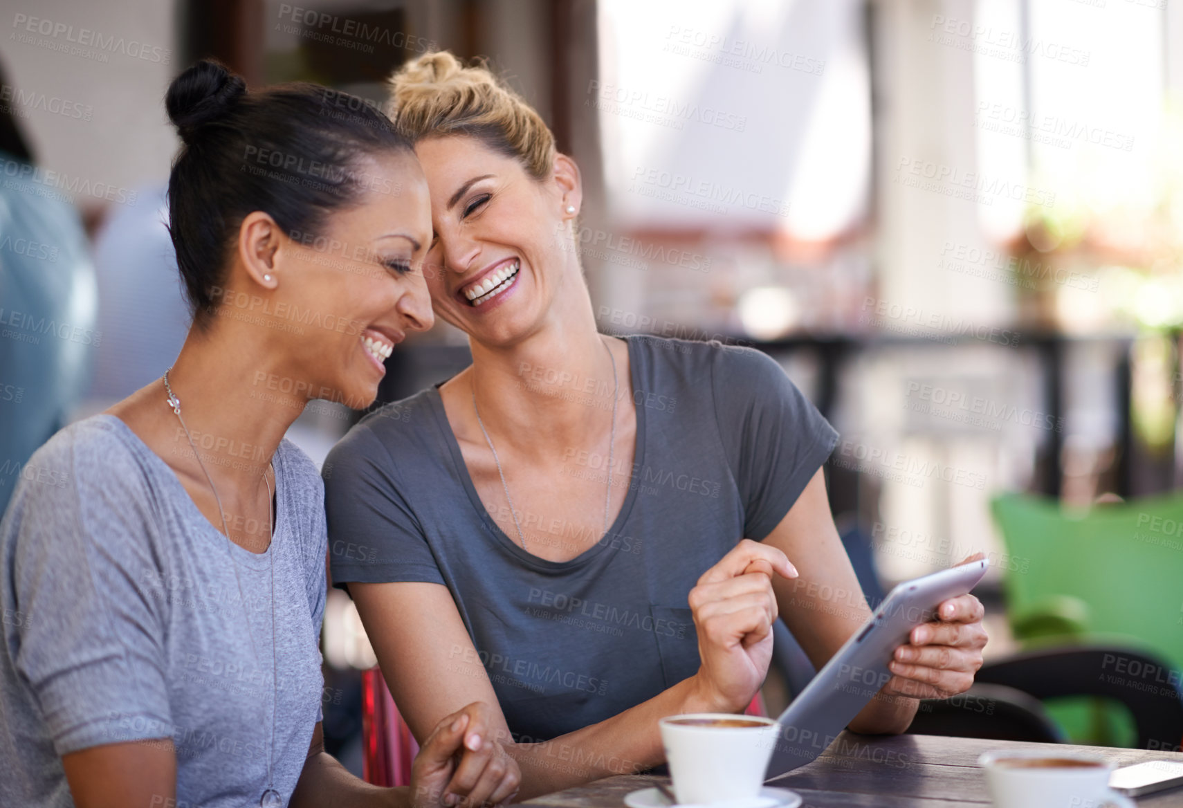 Buy stock photo Conversation, tablet and friends drinking coffee at a cafe together while browsing on social media. Happy, smile and women speaking, laughing and scrolling on a mobile at a restaurant in the city.
