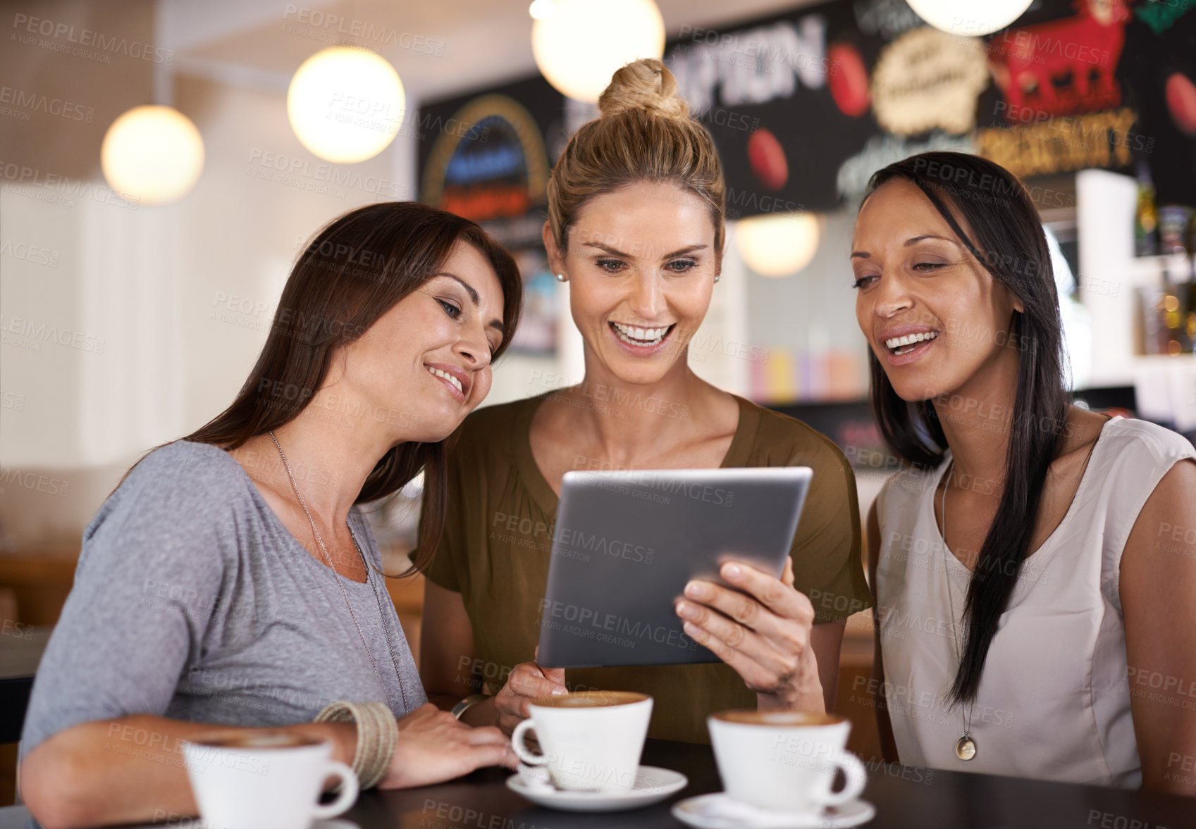 Buy stock photo Woman, together and smile at coffee shop with tablet for online menu or restaurant review, diversity and relax for leisure. Female friends, digital technology and internet to search or browse website