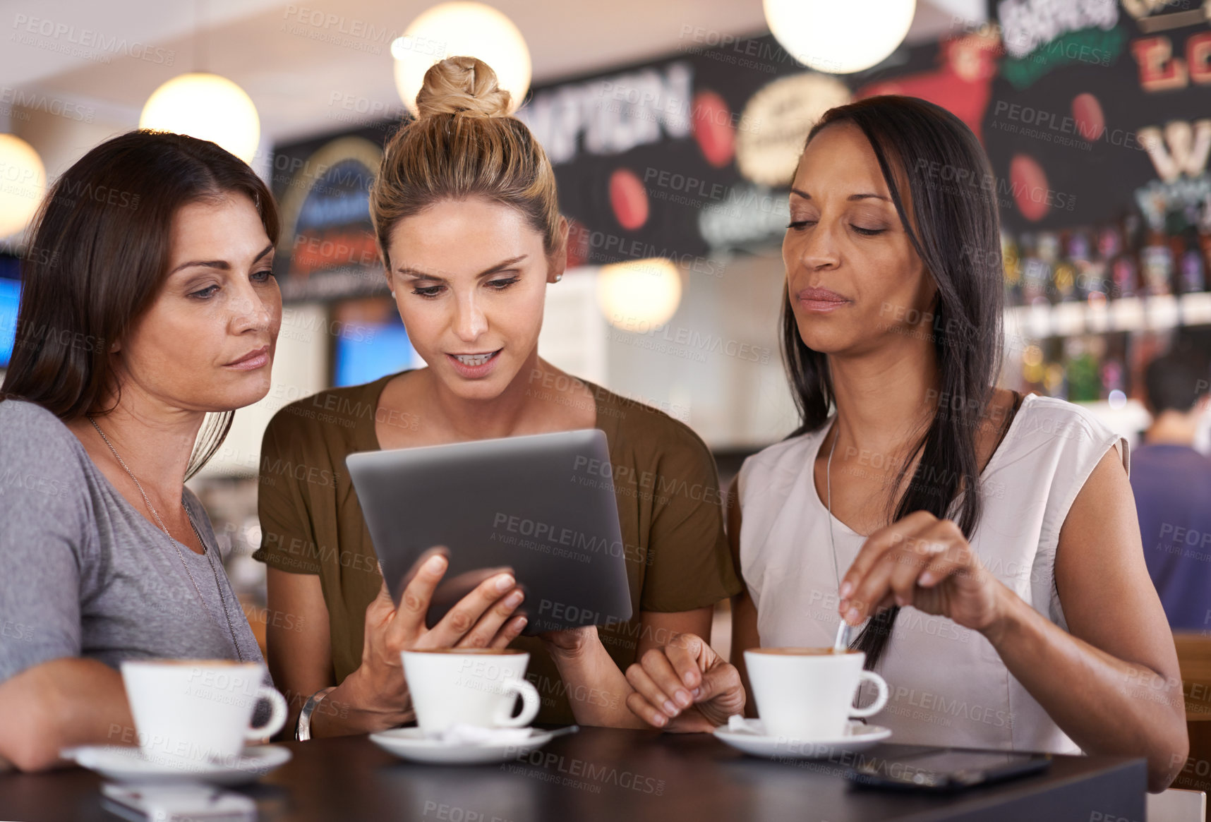 Buy stock photo Woman, together and read at coffee shop with tablet for online menu or restaurant review, diversity and relax for leisure. Female friends, digital technology and internet to search or browse website.