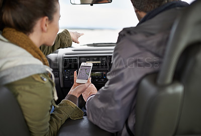 Buy stock photo Road trip, couple and smartphone for navigation in car, adventure and connectivity for travel exploration in nature. People, mobile app and bonding together on holiday, journey and honeymoon in oman