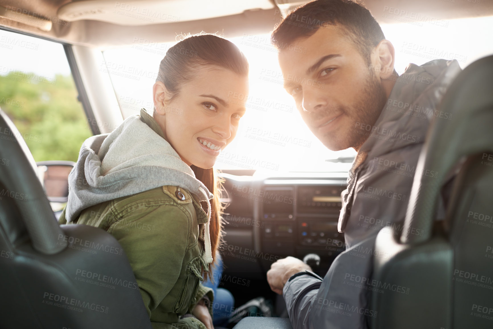 Buy stock photo Couple, smile and portrait in car for road trip, travel or journey in vehicle and outdoor for holiday. Man, woman and happy in seat with radio and jacket for driver, passenger and safety together    