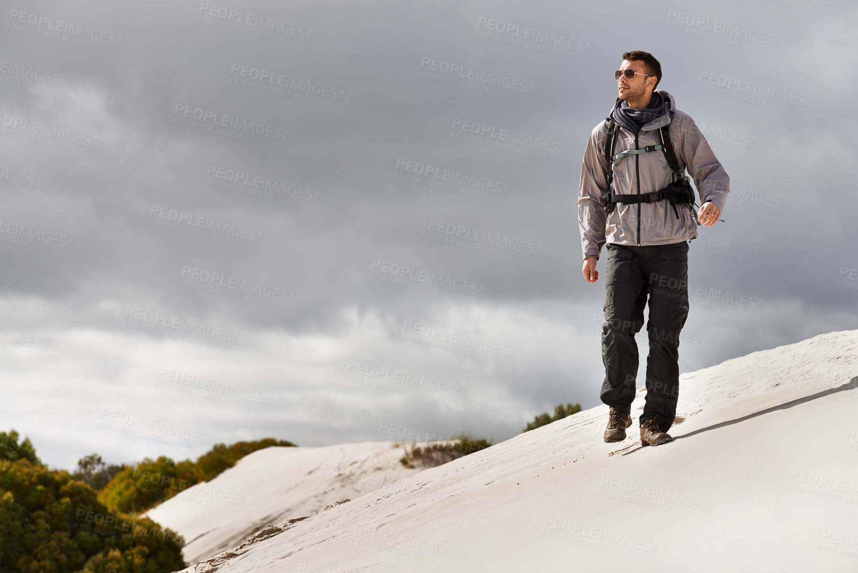 Buy stock photo Travel, fitness or man in desert with backpack for adventure, journey or resort, location or explore. Freedom, holiday or male backpacker in Egypt for sand dunes walking, wellness or hiking in nature