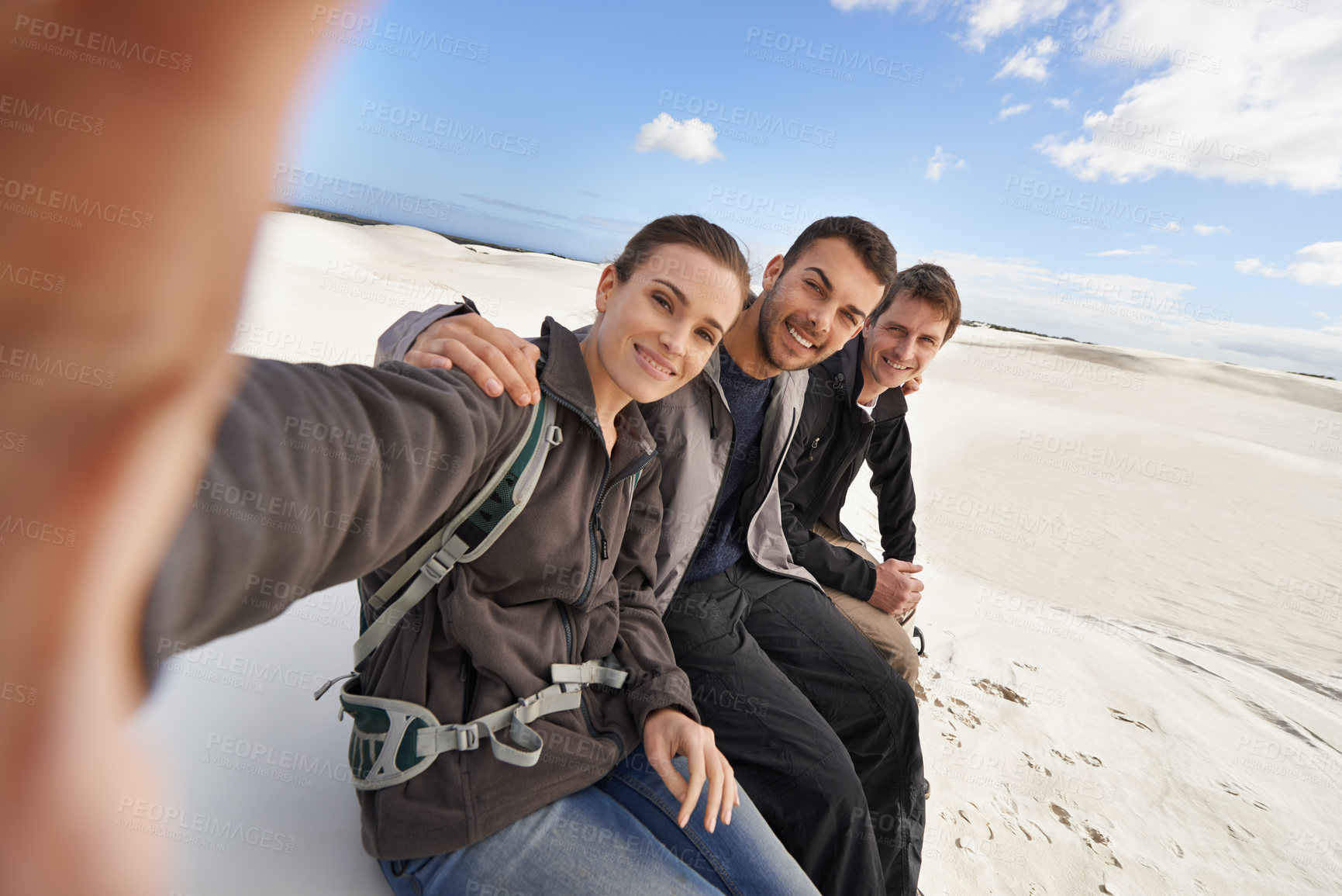 Buy stock photo Friends, smile and selfie in desert for adventure on holiday, road trip and travel together in California. People, happy and excited in sand dunes for vacation or break with bonding for memory.