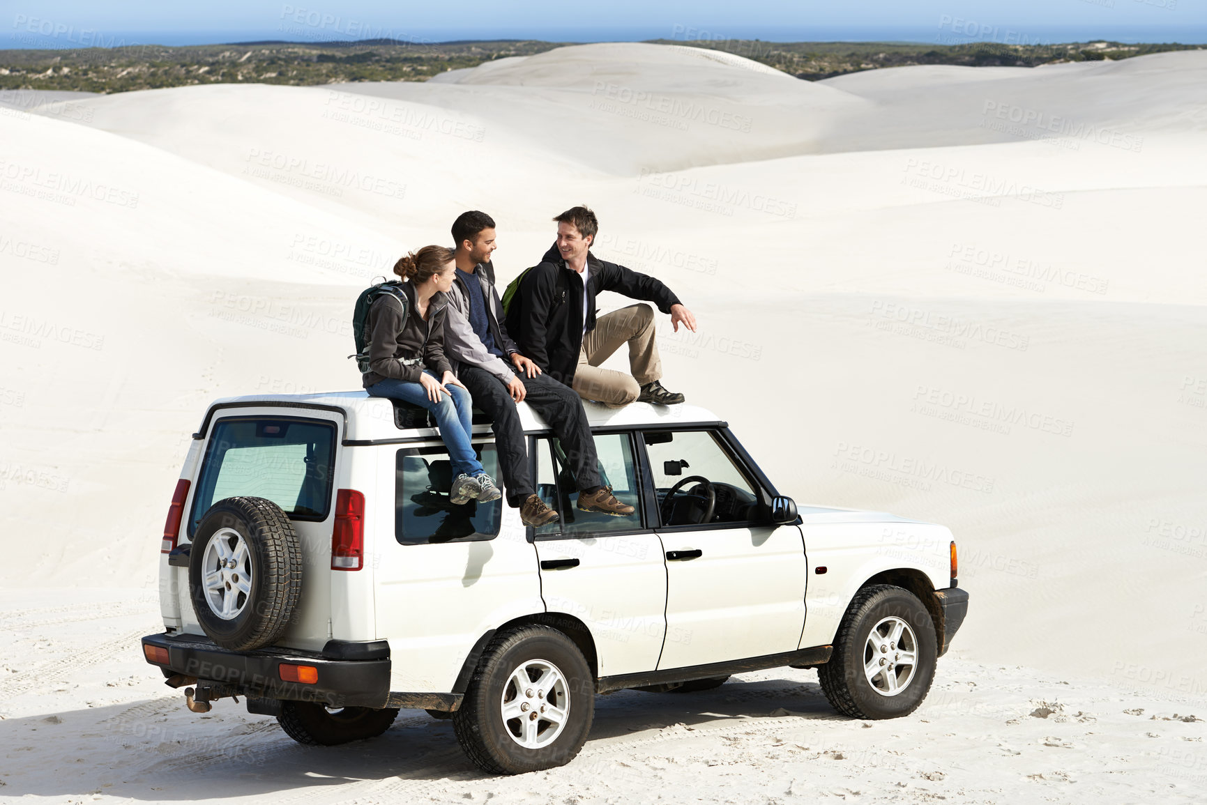 Buy stock photo Relax, car and friends sitting on roof for off road drive, summer holiday and communication in sand dune. Car, transportation and people in nature for getaway vacation, travel and journey in Mexico