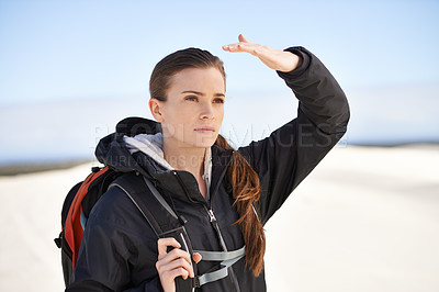 Buy stock photo Hiking, sand dunes and woman in nature walking for adventure, desert landscape and travel for holiday. Hiker, explorer and nomad person in Sahara terrain, outdoor and dry climate for view or scenery