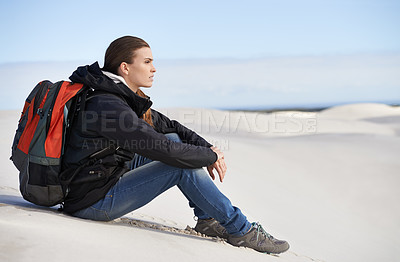 Buy stock photo Hiking, sand dunes or woman in nature to relax for adventure, desert landscape and travel for holiday. Break, thinking or nomad explorer in Sahara terrain, outdoor and dry climate for view or scenery