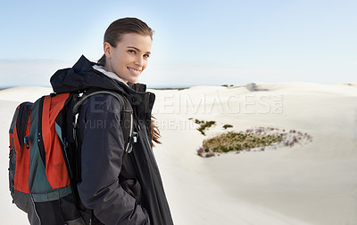 Buy stock photo Portrait, sand dunes or happy woman in nature to hike for adventure, desert landscape and travel for holiday. Scenery, hiker and nomad explorer in Sahara terrain, outdoor and dry climate for view