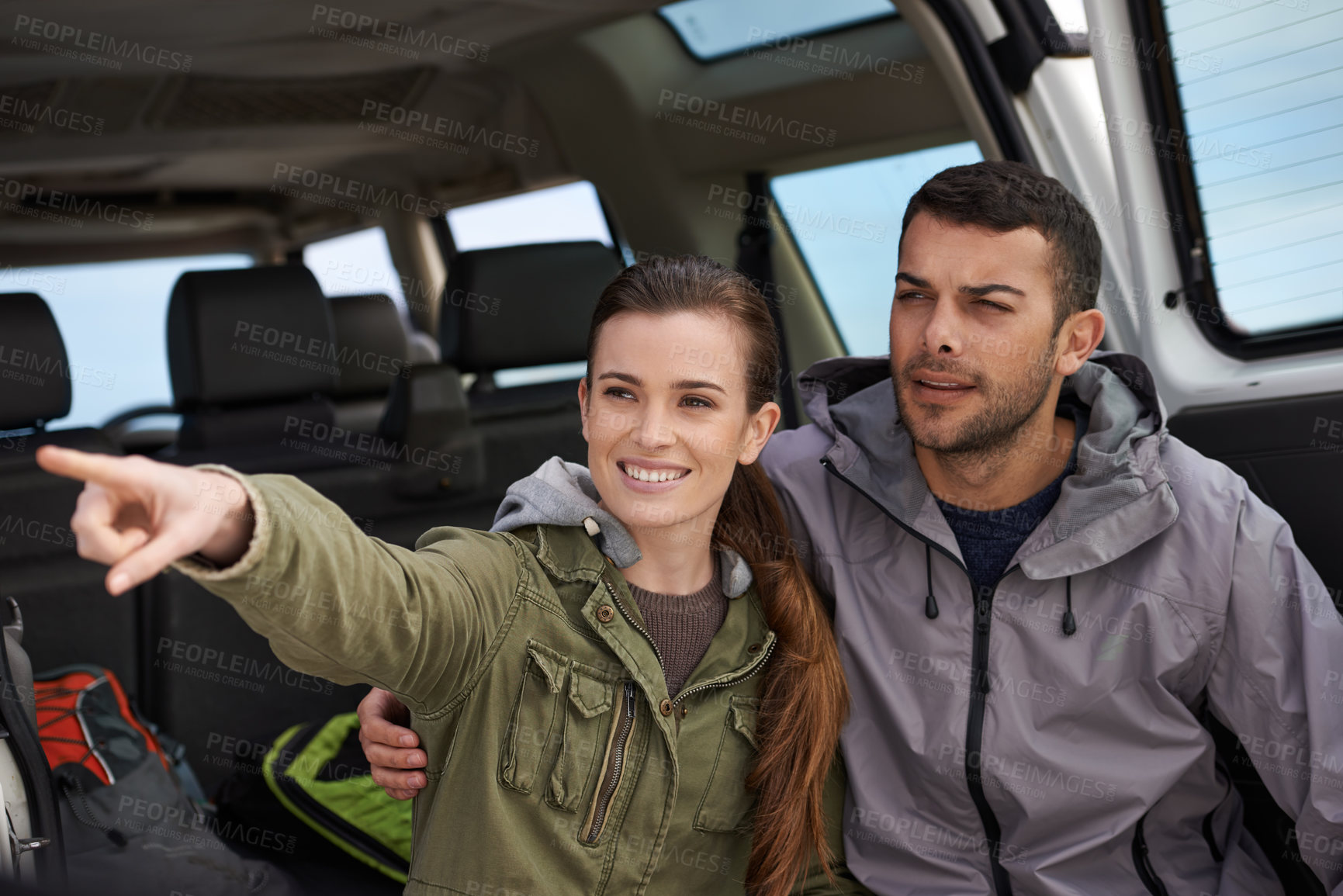 Buy stock photo Couple, car and pointing on roadtrip with travel for adventure, vacation or sightseeing with happiness in countryside. Woman, man or driving in vehicle for holiday journey, tourism and honeymoon trip
