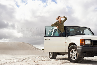 Buy stock photo Road trip, car and woman in a desert for location, search or holiday, adventure and exploration. Travel, stop and female person with vehicle in Egypt for sand dunes journey, nature or waiting outdoor