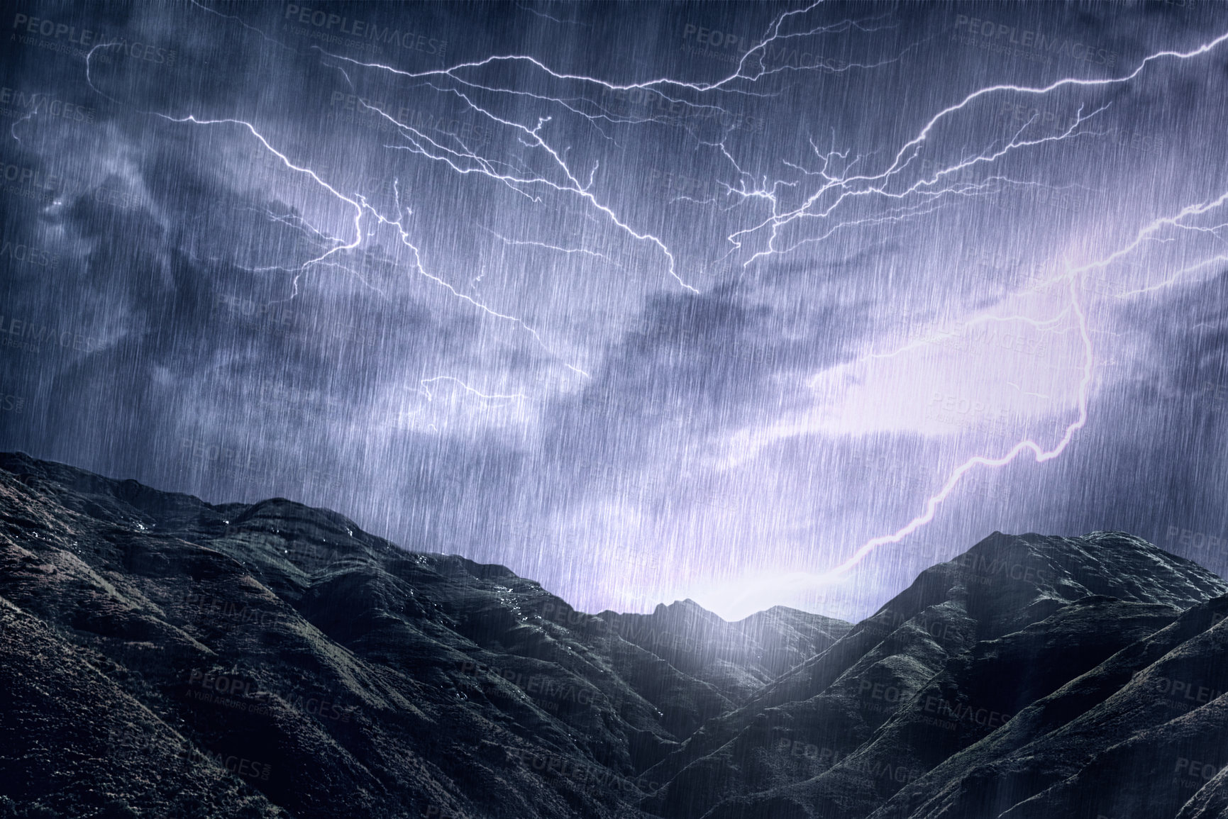 Buy stock photo Shot of a dramatic thunderstorm over a mountain