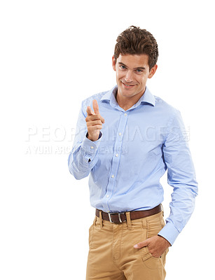 Buy stock photo Portrait, pointing and mockup with a business man in studio isolated on a white background for choice. Fashion, point and smile with a happy young male standing hand in pocket on blank mock up space