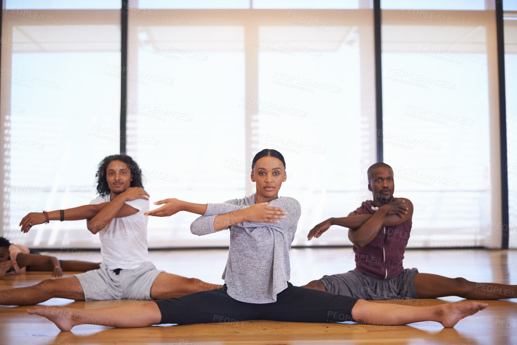 Buy stock photo Dancer, class and people stretching legs on floor to start rehearsal together in studio or academy. Training, body and healthy exercise for fitness in creative school with yoga or pilates workout