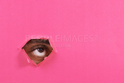Buy stock photo Tear, hole and eye of person on pink background for vision, eyesight and looking for inspiration. Mockup space, creative aesthetic and isolated eyes in studio for thinking, wondering or announcement 