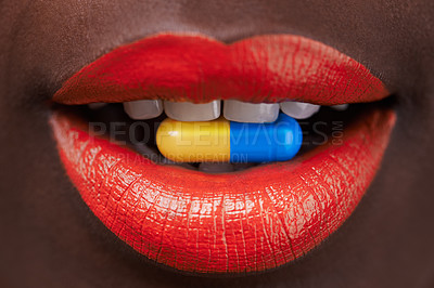 Buy stock photo Cropped view of an african woman with bright red lips with a capsule in her mouth