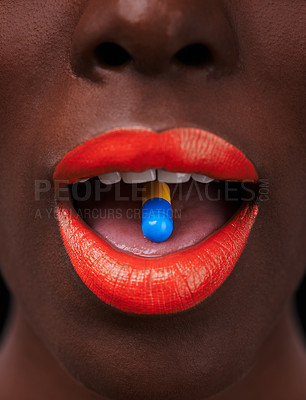 Buy stock photo Black woman, lipstick and pill in mouth for health, beauty supplement and bright makeup color on dark background. Collagen, medicine and tablet for cosmetic care with closeup of orange lip balm