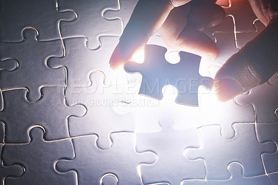 Buy stock photo Conceptual shot of a person's hand building a puzzle