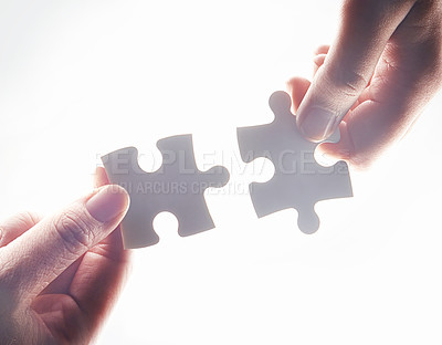 Buy stock photo Hands, puzzle and strategy for teamwork, problem solving or together for support, glow or help by white background. Team building, jigsaw or games for innovation, synergy or solution in collaboration