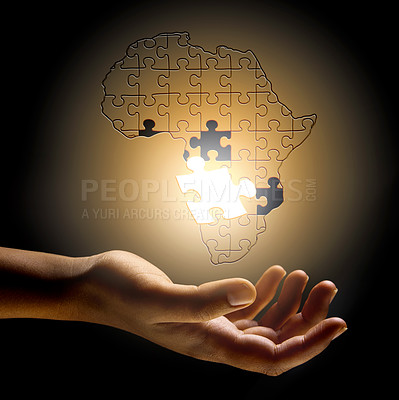 Buy stock photo Closeup, Africa and hand with a puzzle, development and problem solving for growth, future and planning. Zoom, fingers or person with symbol, solidarity and support for global innovation and solution