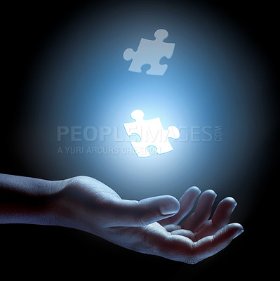 Buy stock photo Puzzle, piece and abstract solution in hand for problem solving, challenge and planning with strategy. Jigsaw, games or shape of idea to glow in light of dark and search for innovation in business