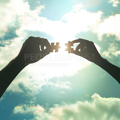 Buy stock photo Cropped shot of hands holding two puzzle pieces