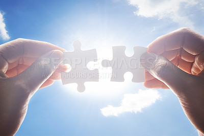Buy stock photo Puzzle, synergy and goal with hands of person on blue sky for achievement, solution and development. Mission, game and cooperation with closeup of jigsaw pieces for support, success and integration