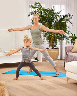 Buy stock photo Full length shot of a mother and daughter doing yoga together