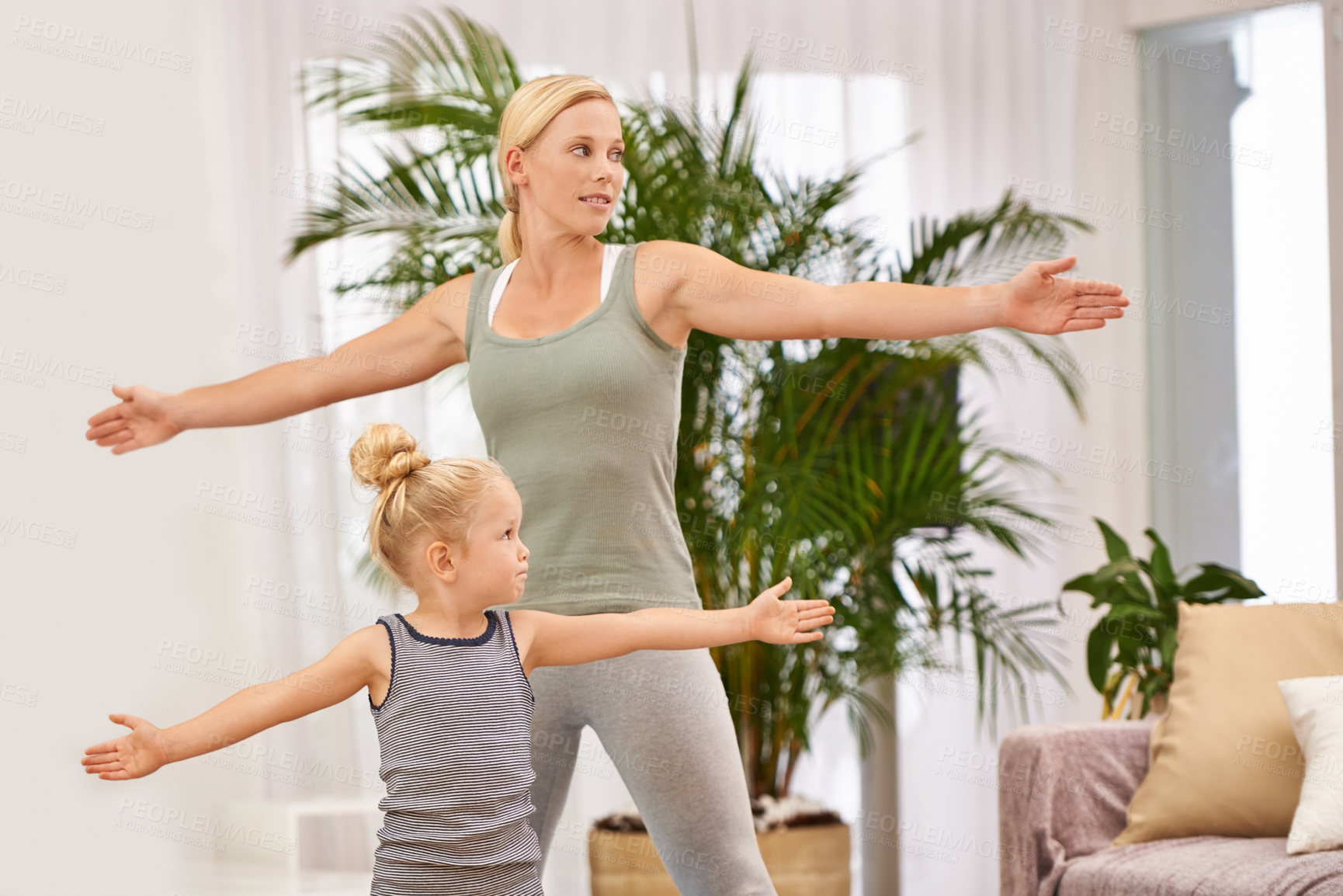 Buy stock photo Yoga, exercise with mom and daughter in living room, stretching out arms for balance and bonding. Woman, young girl and fitness together at family home, health and wellness with love and care