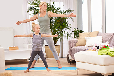 Buy stock photo Yoga, exercise with mother and daughter in living room, stretching out arms for balance and bonding. Woman, young girl and fitness together at family home, health and wellness with love and care