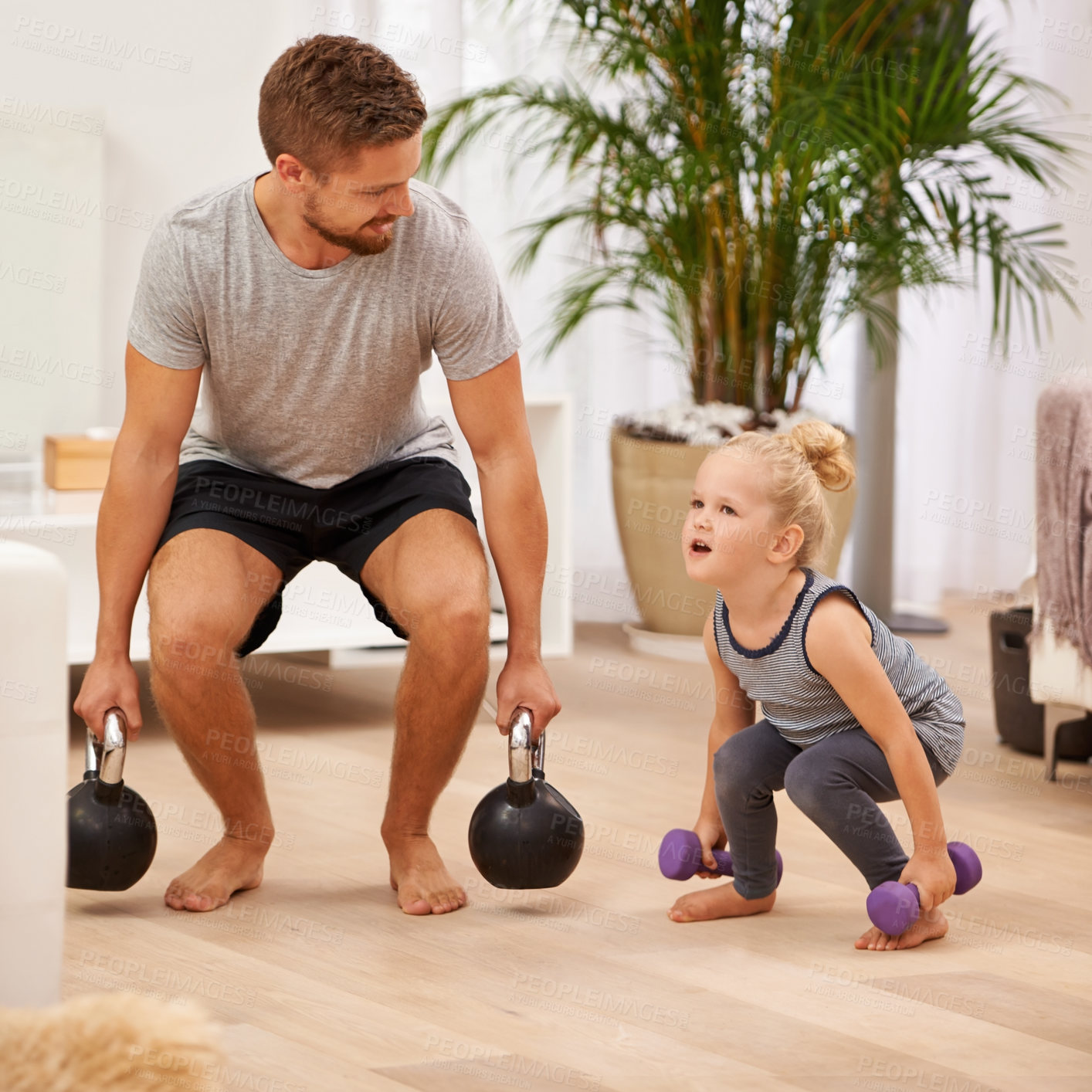 Buy stock photo Full length shot of a father and daughter working out together
