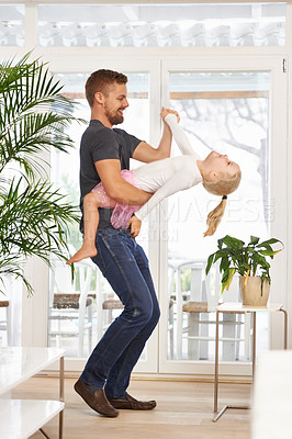 Buy stock photo Man, girl kid and dancing with happiness at home, father and daughter time with love and trust. Single dad, family and bonding with rhythm and moving, playful dip with music and energy in living room