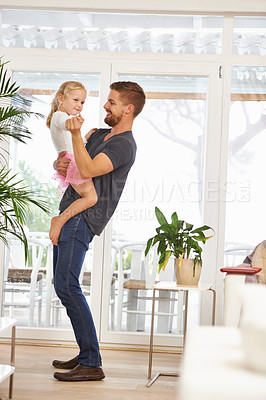 Buy stock photo Man, girl kid and dance with happiness at home, father and daughter time with love and trust. Single dad, family and bonding with rhythm and moving, playful with music and energy in living room