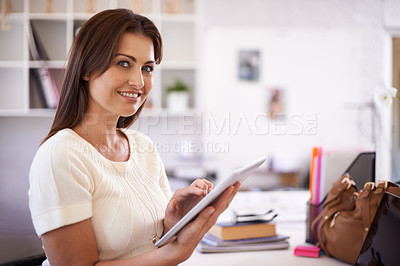 Buy stock photo A beautiful young businesswoman holding a tablet
