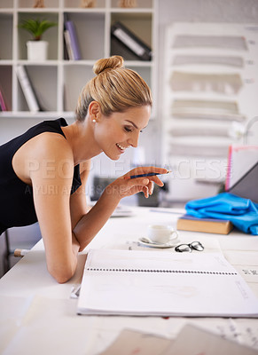 Buy stock photo Designer, woman and thinking for creativity for fashion in morning for inspiration, sketch or career in studio. Person, ideas and happy with book in review, planning or vision for clothes in workshop
