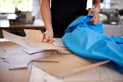 Buy stock photo Fashion designer, patterns and fabric for clothes production, planning and measurements in workshop. Person hands with cardboard or shape of garment for manufacturing, design and textile business