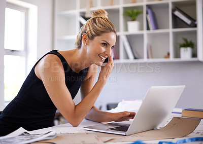 Buy stock photo A beautiful young businesswoman speaking on the phone while working on her laptop