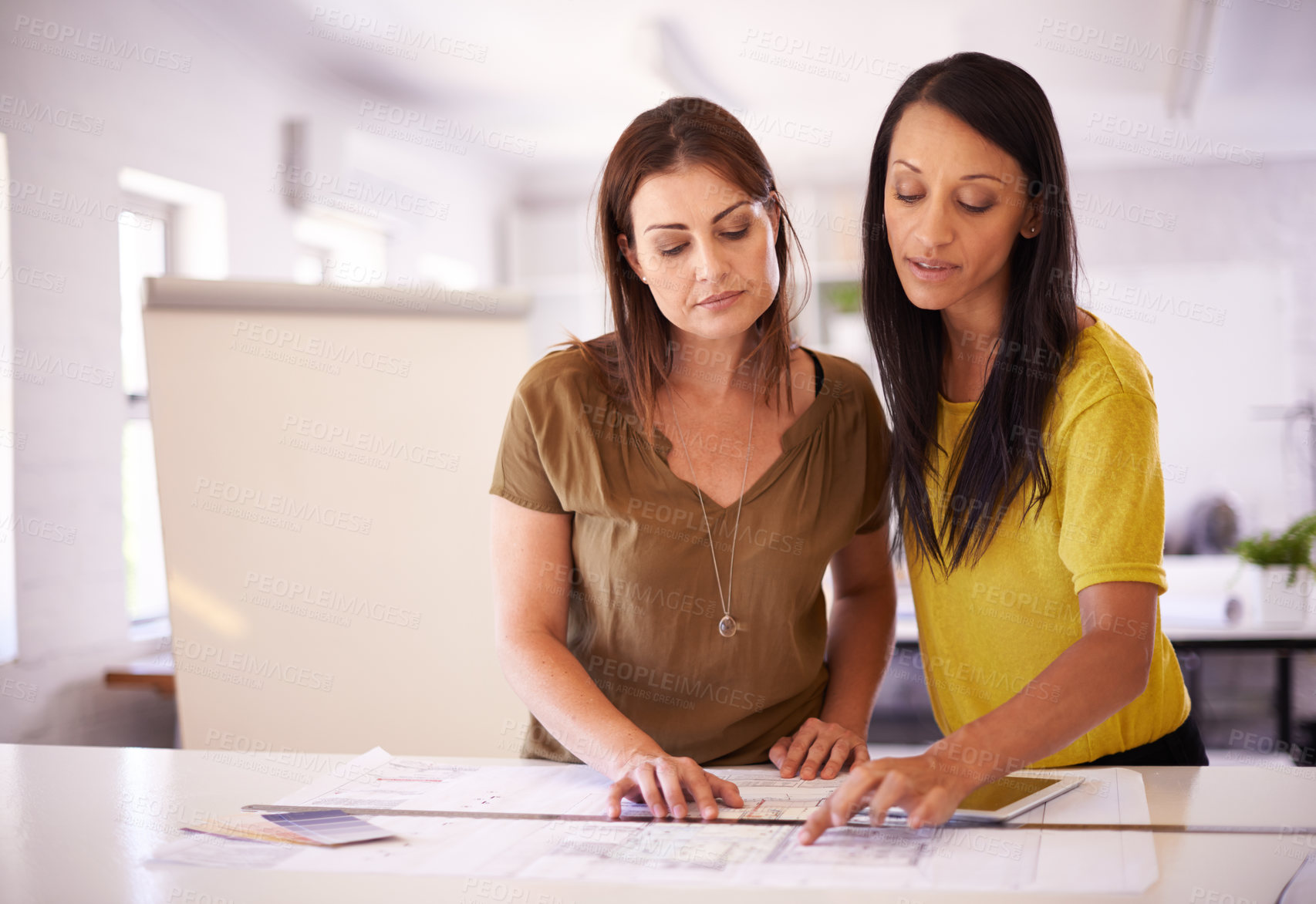 Buy stock photo Architect, women and blueprint in discussion at office with reading, planning and building development. People, team and architecture for property, expansion or documents for project in collaboration
