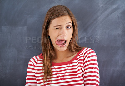 Buy stock photo Tongue out, blackboard and portrait with woman, teacher and education with knowledge and silly. Face, funny and goofy with girl or educator with expression or emoji with reaction or quirky with humor