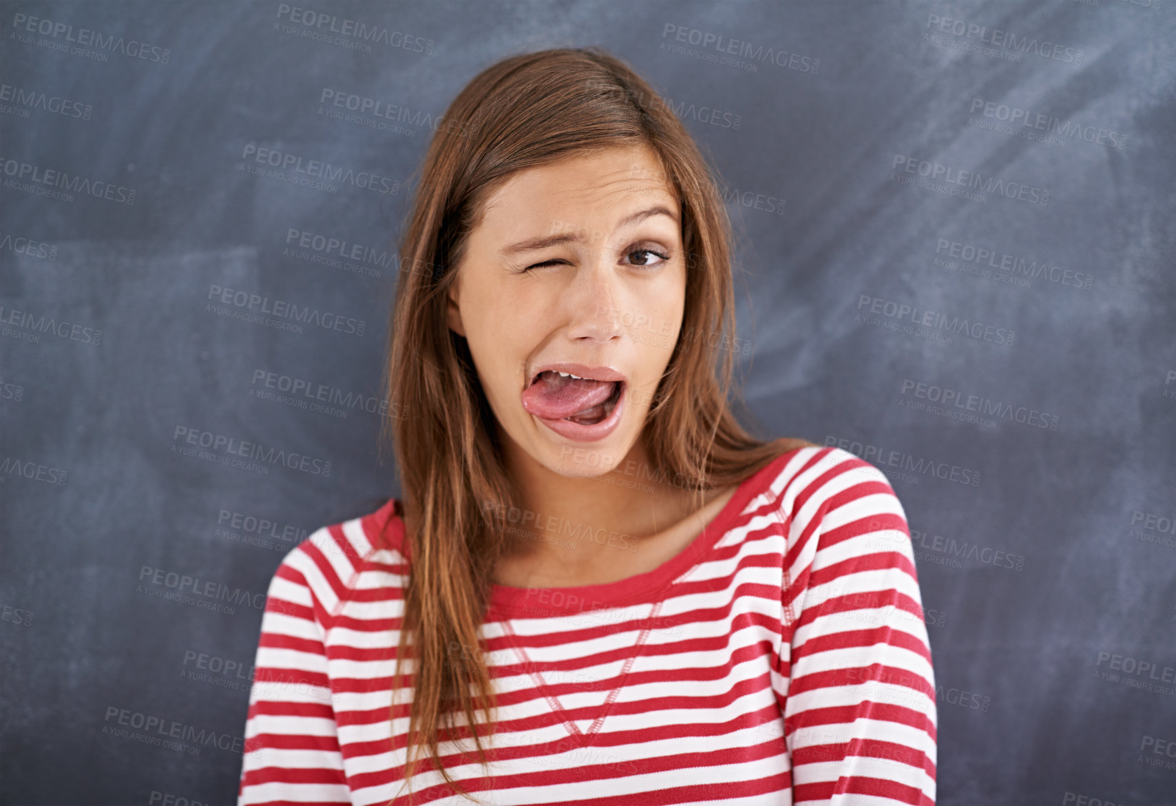 Buy stock photo Tongue out, blackboard and portrait with woman, teacher and education with knowledge and silly. Face, funny and goofy with girl or educator with expression or emoji with reaction or quirky with humor