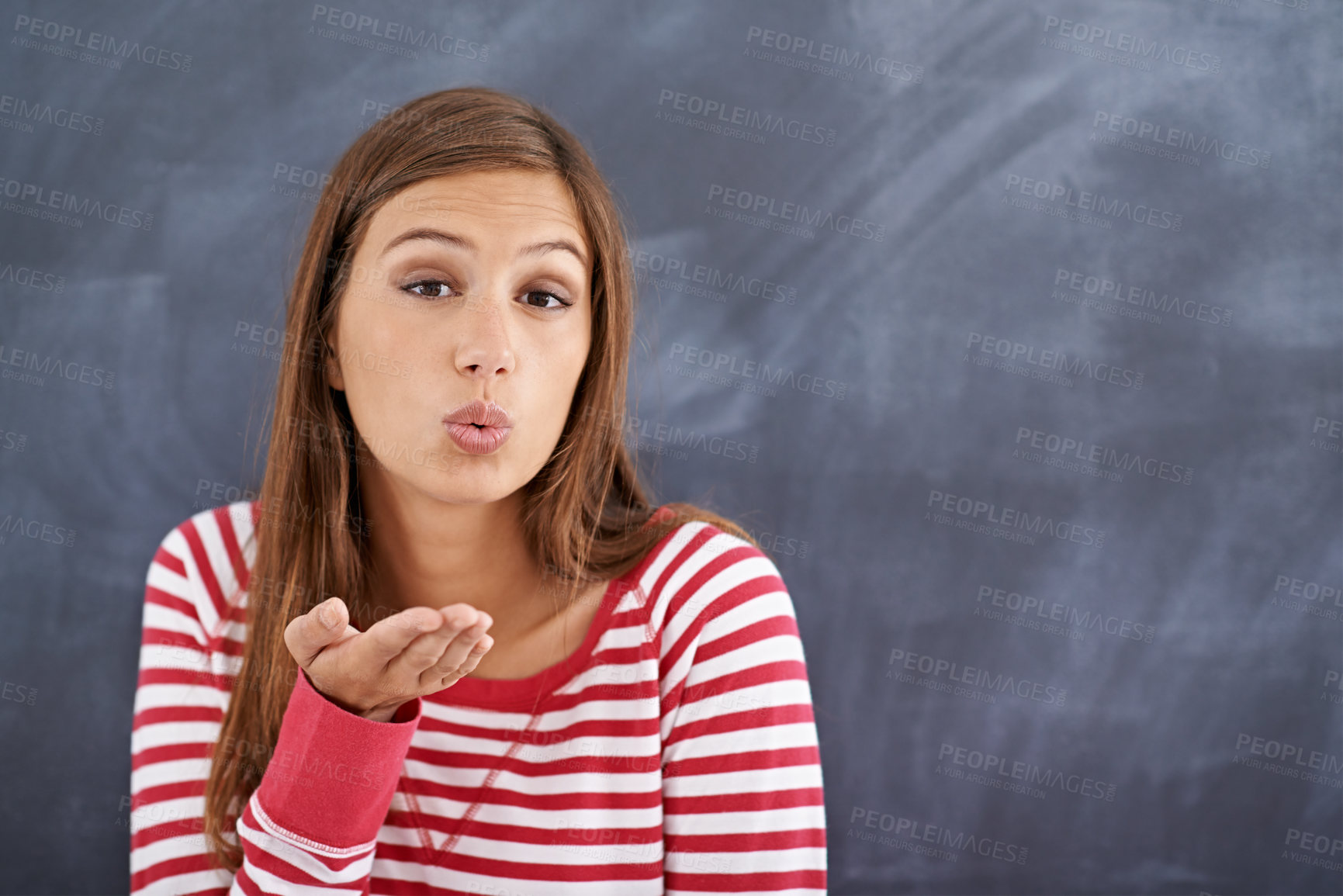 Buy stock photo Portrait, woman and blowing a kiss with blackboard, romance and funny with fun and mockup space. Face, person and girl with love and symbol with emoji and icon with model and cheerful with happiness