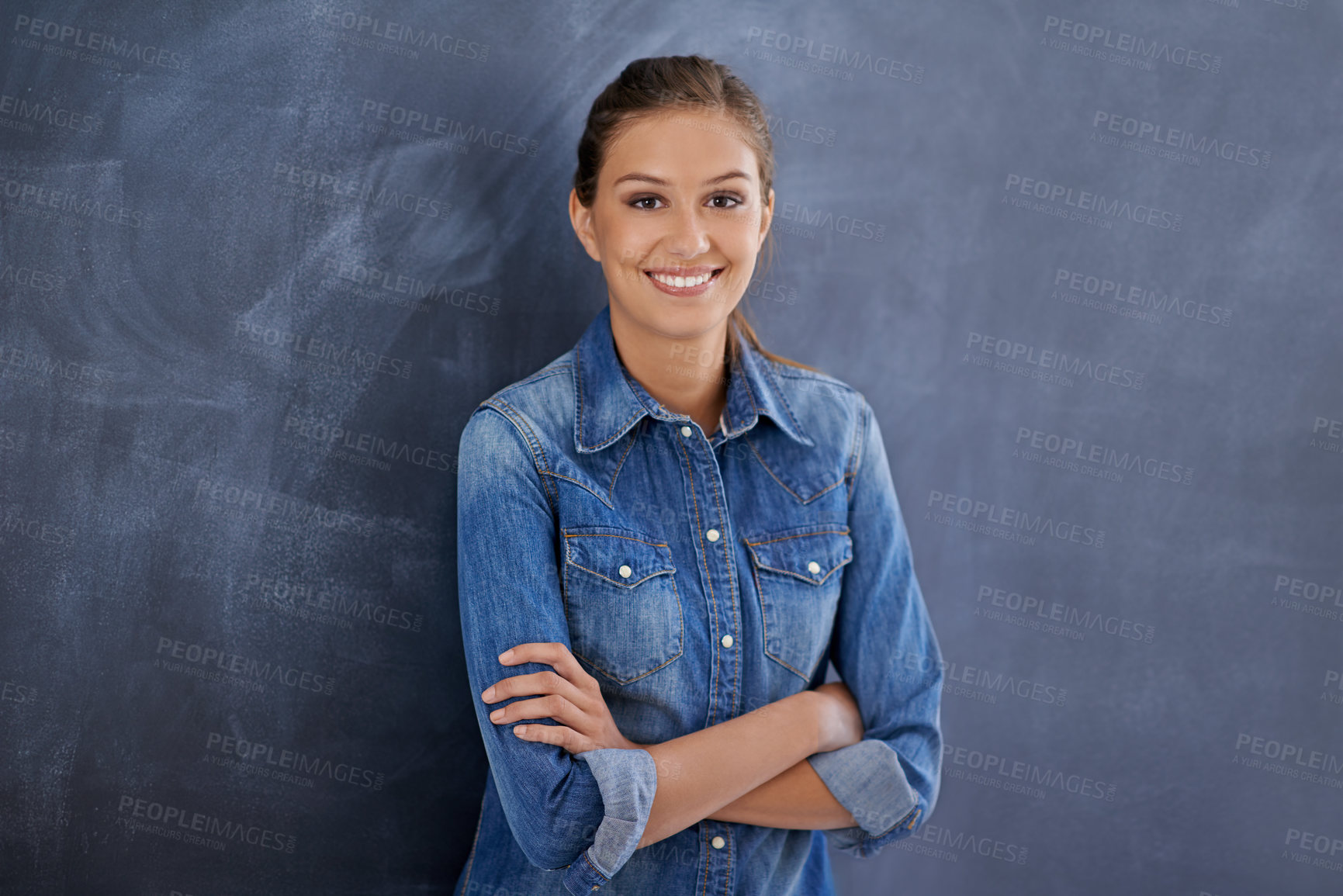 Buy stock photo Portrait of a cheerful young woman standing against