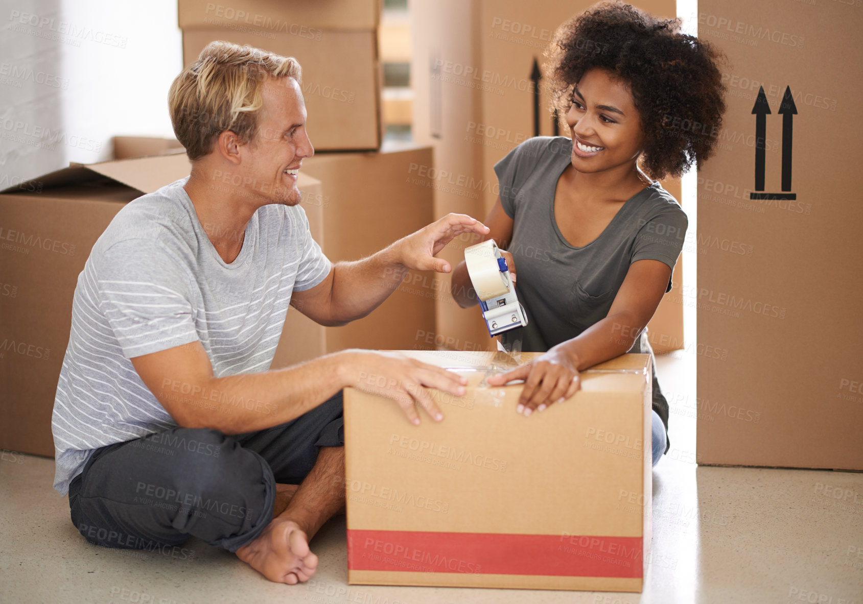 Buy stock photo Moving, tape and couple with new home, box and package for real estate property and courier parcel. Cardboard, delivery and support with packing in a house with a happy homeowner, love and marriage