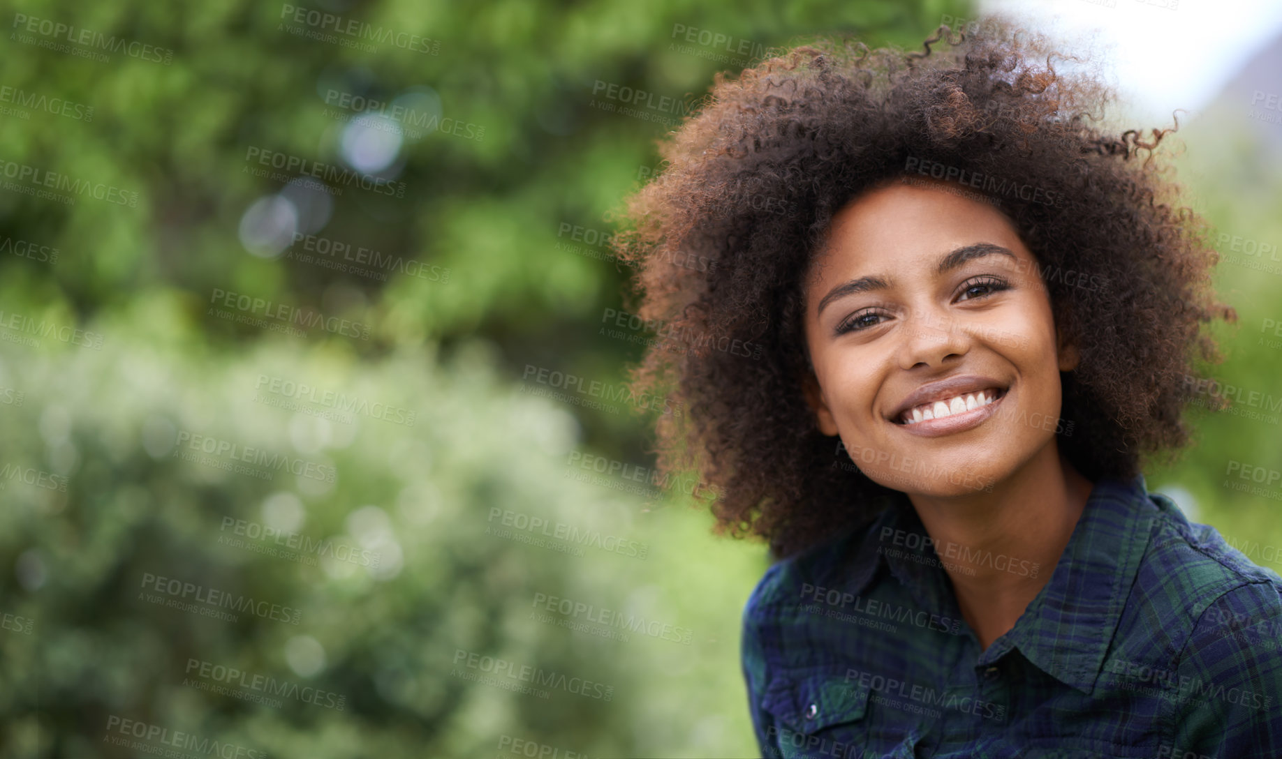 Buy stock photo Black woman outdoor in portrait, smile in nature with positive mindset with mockup space. Headshot of happy female person, young and carefree with curly afro hairstyle and happiness at the park