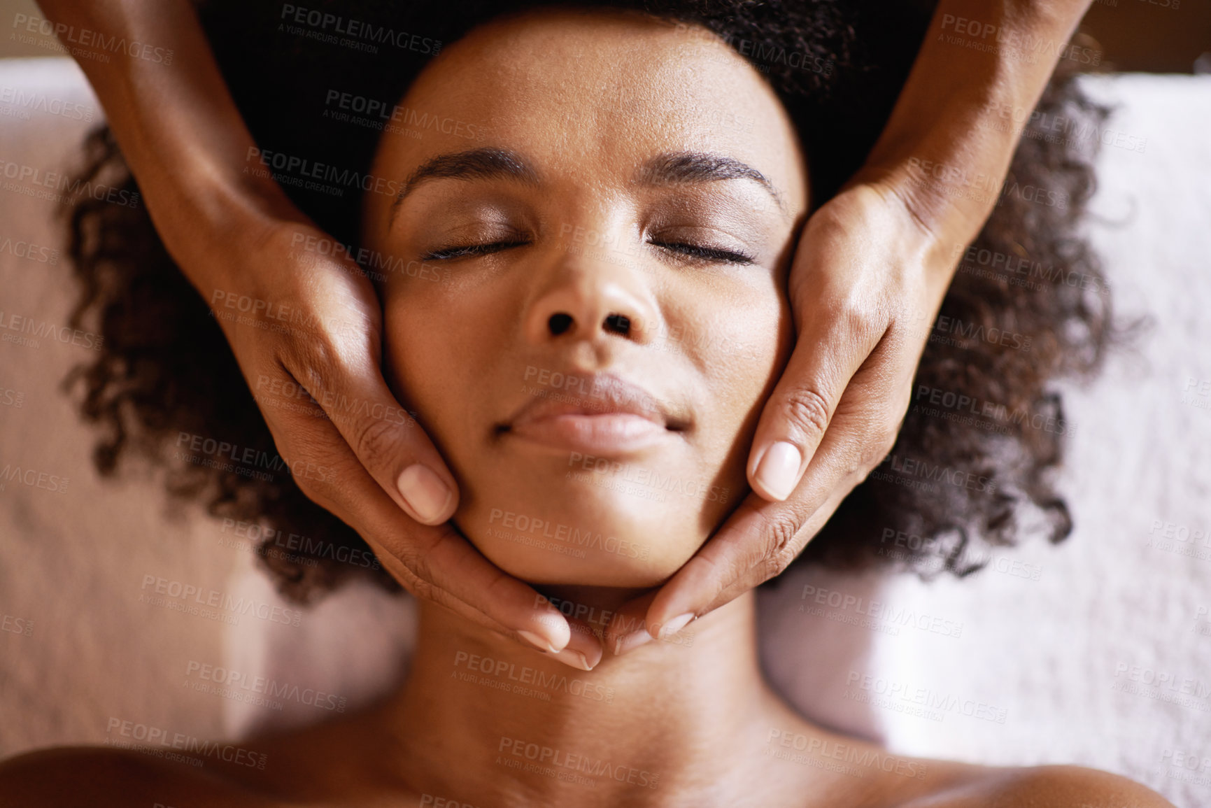 Buy stock photo Woman, spa and massage on face with hands and care for facial, wellness and beauty treatment on bed. Above, towel and calm african female person with skincare and relax at a hotel with skin glow 