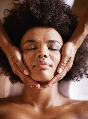 Buy stock photo Woman, cosmetics and massage on face with hands and care for facial, spa and beauty treatment on bed. Above, towel and calm african female person with skincare and relax at a hotel with skin glow 