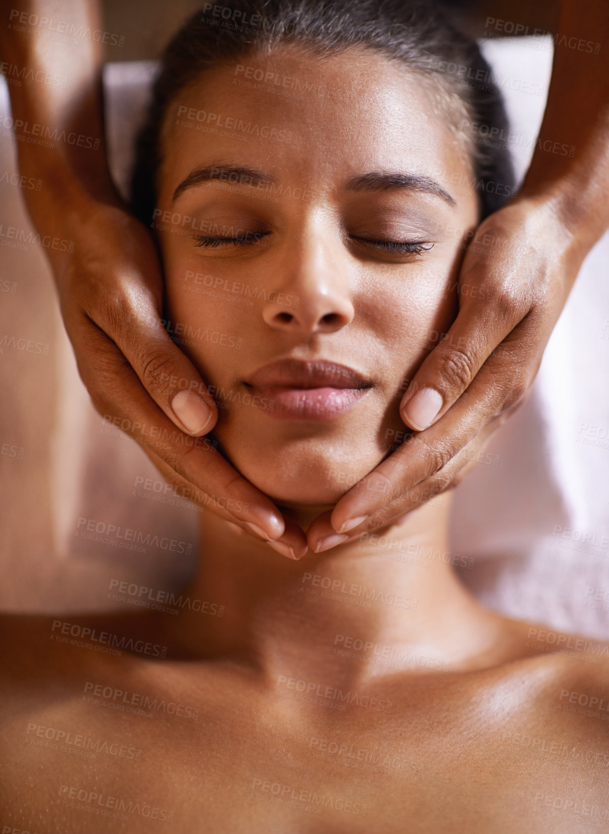 Buy stock photo Woman, spa and massage on face with hands and care for facial, wellness and beauty treatment on bed. Above, towel and calm african female woman with skincare and relax at a hotel with skin glow 