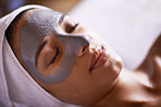 Nourishing her skin with a facial treatment