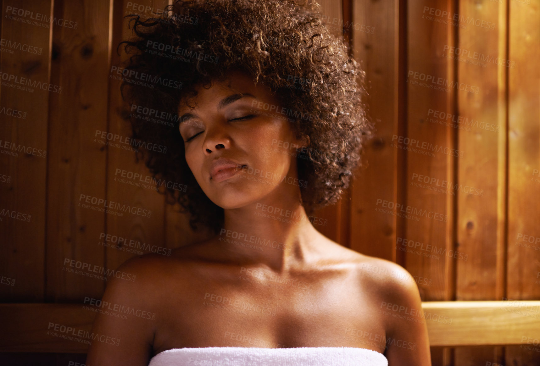 Buy stock photo A young woman relaxing in the sauna at a spa